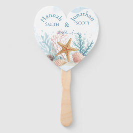 海辺の幻想的な星型のタツナミトゲウニとサンゴのウェディング ハンドファン