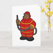 消防士のクマがホースを持って カード (黄色い花)