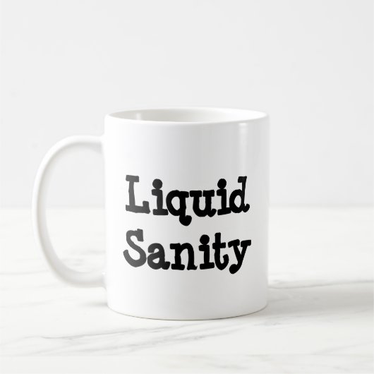 液体正気 – Mug-A-Tupde コーヒーマグカップ (左)