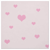 淡いピンクに散らばったピンクのハート ファブリック (見本)