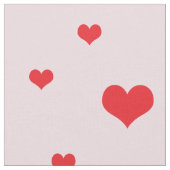 淡いピンク色の散乱赤いハート ファブリック (クローズアップ)