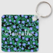 淡い紫のフローラの花と緑の葉植物 キーホルダー (裏面)