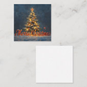 温かなライトに照らされた雪のクリスマスツリー ノートカード (正面/裏面)