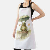 湖で傘をさすかわいいカエル エプロン (インサイチュ)