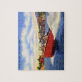 湖のCoeurのd'Alene、アイダホの木の速度のボート ジグソーパズル (縦)