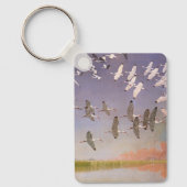 湿地に飛んでいるイビスの群れヴィンテージ キーホルダー (正面)