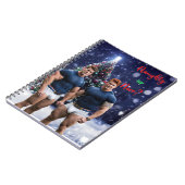 滑りやすいジョー飾の雪に覆われたクリスマスツリー ノートブック (左側)