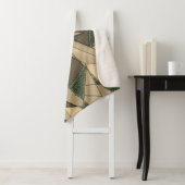 '濃い緑の背景'上のベージュ三角形切り出し シェルパブランケット (インサイチュ)