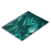 濃い緑、熱帯のジャングルの葉。 ノートブック (左側)