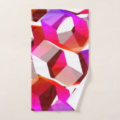 濃い赤の背景に多くの六角形が色付けされている バスタオルセット (ハンドタオル)