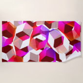 濃い赤の背景に多くの六角形が色付けされている ビーチタオル (正面)