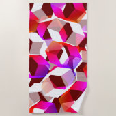 濃い赤の背景に多くの六角形が色付けされている ビーチタオル (正面)