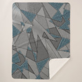 灰色の三角形の切り出しで粗い濃い青の部分 シェルパブランケット (正面)