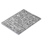 灰色の石の壁、抽象芸術背景。 ノートブック (左側)