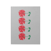 灰色の背景に赤い花の靴下に入れて贈る小さなクリスマスプレゼント ノートパッド (回転)