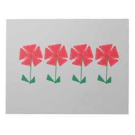 灰色の背景に赤い花の靴下に入れて贈る小さなクリスマスプレゼント ノートパッド