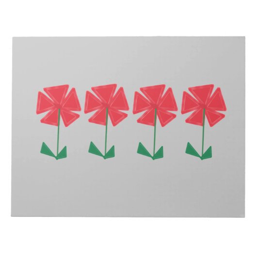 灰色の背景に赤い花の靴下に入れて贈る小さなクリスマスプレゼント ノートパッド (正面)