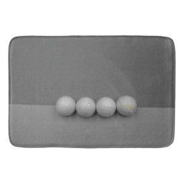 灰色の背景のゴルフボール バスマット