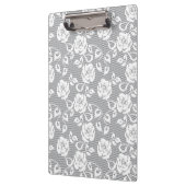 灰色の背景の白いレースパターン クリップボード (左)