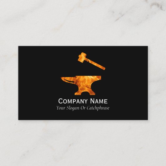 炎を上げるアンビルとハンマー鍛冶金 名刺 (正面)