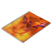 炎カラフルの飛んでいる背景に立つフェニックス ノートブック (左側)