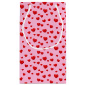 点在する赤いハート（ピンク） スモールペーパーバッグ (裏面)