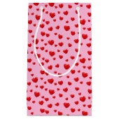 点在する赤いハート（ピンク） スモールペーパーバッグ (正面)