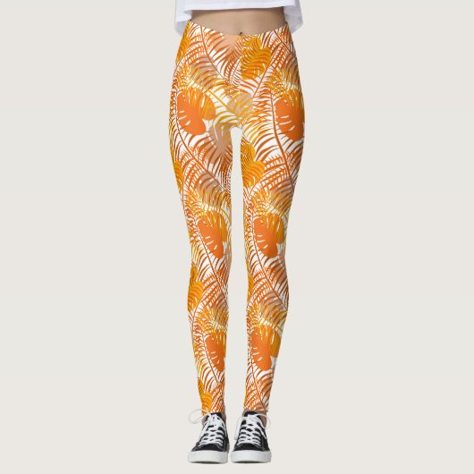 焼きオレンジ色のトロピカルパームパターン(の模様が)あるリーフ レギンス (正面)