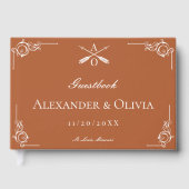 焼けたオレンジ色のモノグラム結婚と矢印 ゲストブック (正面)