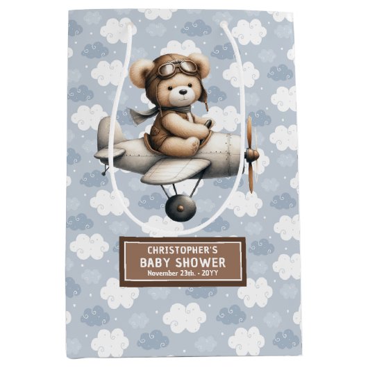 熊抱き枕付き男の子の赤飛んでいるちゃんシャワーデザイン ミディアムペーパーバッグ (正面)