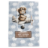 熊抱き枕付き男の子の赤飛んでいるちゃんシャワーデザイン ミディアムペーパーバッグ (裏面)