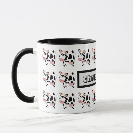 牛のデザインのマグカップ マグカップ (左)