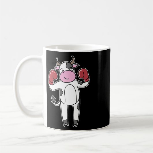 牛はボクシングをする コーヒーマグカップ (左)