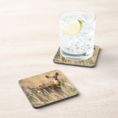 牧草地に生息するイシノシカ コースター (右側)