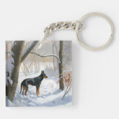 (犬)ドーベルマン・ピンシェルは雪のクリスマスを許す キーホルダー (裏面)