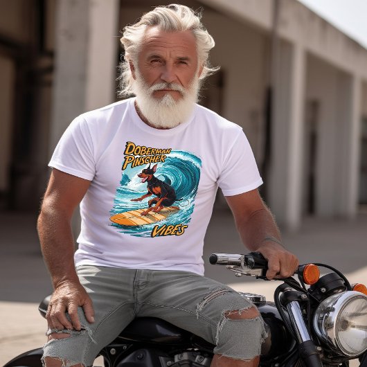 (犬)ドーベルマン・ピンシェルサーファーライディングトロピカルウェーブ Tシャツ