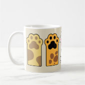 猫がカラフル足を踏む コーヒーマグカップ (左)