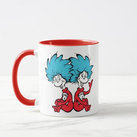 猫が帽子を被る マグカップ (左)