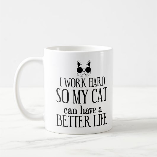 猫が幸せに暮らせるように一生懸命働く コーヒーマグカップ (左)