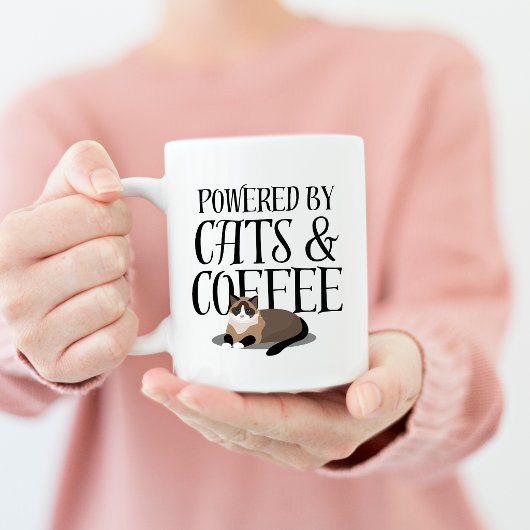 猫とコーヒーが支えるパワー コーヒーマグカップ