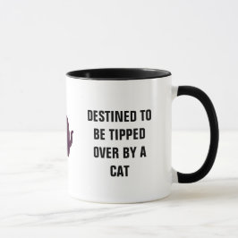 猫によってひっくり返されるために予定される マグカップ