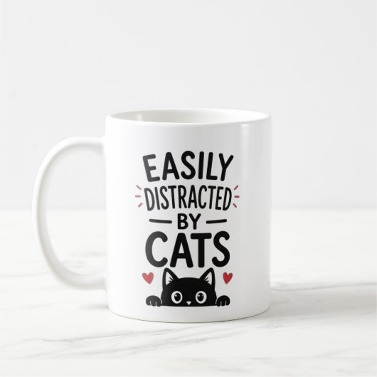 猫に気を取られがち ネコ好きのための面白い名言 コーヒーマグカップ (左)