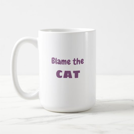 「猫のせいにする」という猫の言い訳おもしろい コーヒーマグカップ (左)