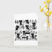 猫のキティが音楽の音符とクレフで演奏するミュージシャンのアート カード (黄色い花)