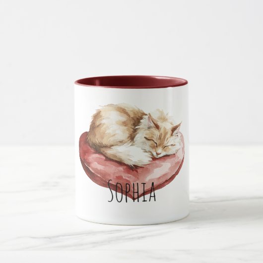 猫の赤いハートの枕 マグカップ (中央)
