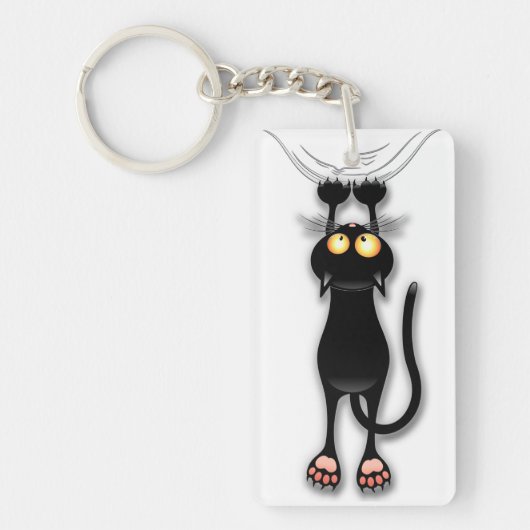 猫の面白いキャラクターが布を引っかく キーホルダー (正面)