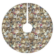 猫はクリスマスツリーのスカートの先頭に立ちます