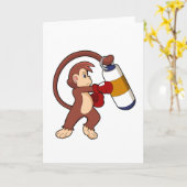 猿がボクシングでパンチングバッグを叩く カード (黄色い花)