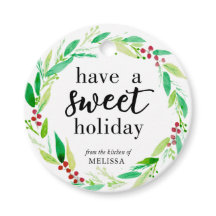 甘いホリデーグッズ焼いたクリスマスリースを持つ