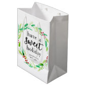 甘いホリデーグッズ焼いたクリスマスリースを持つ ミディアムペーパーバッグ (正面アングル)